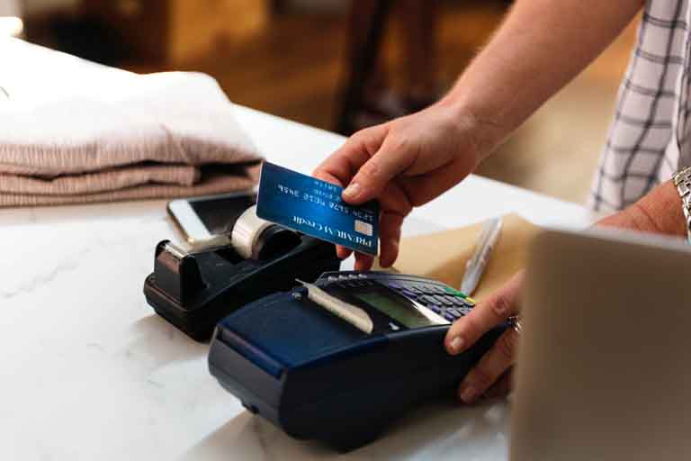hand swiping credit card